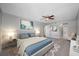 Main bedroom with ceiling fan and en-suite bathroom at 1655 S Highland Ave # E223, Clearwater, FL 33756