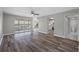 Open living room with wood-look floors and pool view at 1655 S Highland Ave # E223, Clearwater, FL 33756