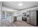Updated kitchen featuring stainless steel appliances and granite counters at 1655 S Highland Ave # E223, Clearwater, FL 33756