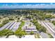 Aerial view of an apartment building with pool and parking at 1655 S Highland Ave # E223, Clearwater, FL 33756