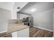 Kitchen with granite countertops and white cabinets at 1655 S Highland Ave # E223, Clearwater, FL 33756