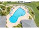 Kidney-shaped community pool with plenty of lounge chairs at 1655 S Highland Ave # E223, Clearwater, FL 33756