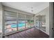 Sunroom with pool view and wood-look flooring at 1655 S Highland Ave # E223, Clearwater, FL 33756