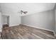 Spacious living room with wood-look flooring at 1655 S Highland Ave # E223, Clearwater, FL 33756