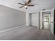Bedroom with ceiling fan and access to hallway at 1655 S Highland Ave # E223, Clearwater, FL 33756