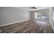 Spacious living room featuring wood-look floors and lots of natural light at 1655 S Highland Ave # E223, Clearwater, FL 33756