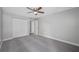 Bedroom with gray carpeting and double doors at 1655 S Highland Ave # E223, Clearwater, FL 33756