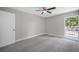 Bright bedroom with grey walls and carpet at 1655 S Highland Ave # E223, Clearwater, FL 33756
