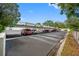 Covered parking lot with several cars parked under shade structures at 1655 S Highland Ave # E223, Clearwater, FL 33756