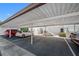 Covered parking carport with several cars parked at 1655 S Highland Ave # E223, Clearwater, FL 33756