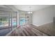Dining area with pool views and wood-look floors at 1655 S Highland Ave # E223, Clearwater, FL 33756