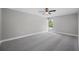 Large bedroom with plush carpeting and a ceiling fan at 1655 S Highland Ave # E223, Clearwater, FL 33756