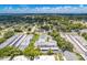 Aerial view of condo community with pool and tennis courts at 1655 S Highland Ave # E223, Clearwater, FL 33756