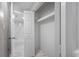 Clean bathroom with white tile and built-in shelving at 1655 S Highland Ave # E223, Clearwater, FL 33756