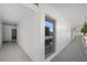 Building hallway with light colored walls at 1655 S Highland Ave # E223, Clearwater, FL 33756