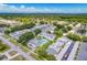Aerial view of condo community with pool and ample parking at 1655 S Highland Ave # E223, Clearwater, FL 33756