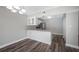 Kitchen features granite countertops and white cabinets at 1655 S Highland Ave # E223, Clearwater, FL 33756