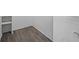 Walk-in closet with shelving and wood-look flooring at 1655 S Highland Ave # E223, Clearwater, FL 33756