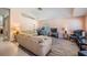 Bright living room with neutral colors, hardwood floors, and ample seating at 11314 Misty Isle Ln, Riverview, FL 33579
