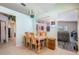 Casual dining area with wood table and chairs, adjacent to the kitchen at 11314 Misty Isle Ln, Riverview, FL 33579