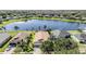 Aerial view of house with lake view at 11314 Misty Isle Ln, Riverview, FL 33579