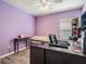 Home office with desk, tanning bed, and window with blinds at 11314 Misty Isle Ln, Riverview, FL 33579