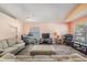 Bright living room with neutral colors, hardwood floors, and ample seating at 11314 Misty Isle Ln, Riverview, FL 33579
