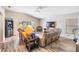 Living Room with large sectional sofa, wood flooring, and natural light at 11314 Misty Isle Ln, Riverview, FL 33579