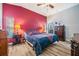 Main bedroom with a king-size bed and large dresser at 11314 Misty Isle Ln, Riverview, FL 33579