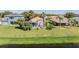 Aerial view of home and backyard with lake access at 11314 Misty Isle Ln, Riverview, FL 33579
