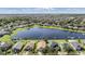 Aerial view of house and lake at 11314 Misty Isle Ln, Riverview, FL 33579