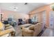 Bright living room with neutral colors, hardwood floors, and ample seating at 11314 Misty Isle Ln, Riverview, FL 33579