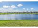 Scenic view of lake and neighborhood homes at 11314 Misty Isle Ln, Riverview, FL 33579