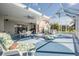 Large patio with lake view, seating, and hot tub at 11314 Misty Isle Ln, Riverview, FL 33579