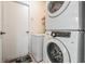 Laundry room with washer, dryer, and extra freezer at 11314 Misty Isle Ln, Riverview, FL 33579