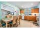Kitchen with light wood cabinets, white appliances, and ample counter space at 11314 Misty Isle Ln, Riverview, FL 33579