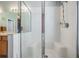 Bathroom with a walk-in shower and tiled walls at 11314 Misty Isle Ln, Riverview, FL 33579