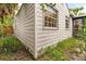 Side view of a charming light-grey house at 3107 W San Juan St, Tampa, FL 33629