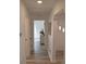 Light and airy hallway with wood-look floors at 1921 W Grace St, Tampa, FL 33607