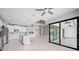 Open concept kitchen with island, stainless steel appliances and views to Gathering room and lanai at 5217 Forbes Ter, Port Charlotte, FL 33981