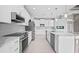 Modern kitchen with stainless steel appliances and white cabinetry at 5217 Forbes Ter, Port Charlotte, FL 33981