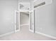 Open concept hallway with double doors leading to another room at 5217 Forbes Ter, Port Charlotte, FL 33981