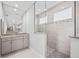 Modern bathroom with granite vanity, large shower and glass enclosure at 5217 Forbes Ter, Port Charlotte, FL 33981