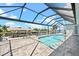 Stunning pool and patio area with canal views and covered lanai at 5217 Forbes Ter, Port Charlotte, FL 33981