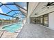 Stunning pool and patio area with canal views and covered lanai at 5217 Forbes Ter, Port Charlotte, FL 33981