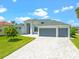 Beautiful two-story home with three-car garage and paver driveway at 5217 Forbes Ter, Port Charlotte, FL 33981