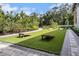 Community lawn with cornhole; great for outdoor fun at 9276 Starry Night Ave, Sarasota, FL 34241