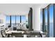 Modern dining room with water views and gray table at 2912 W Santiago St # 2104, Tampa, FL 33629