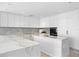 Modern kitchen with white cabinets and marble island at 2912 W Santiago St # 2104, Tampa, FL 33629