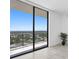 Bedroom featuring sliding doors opening to a scenic balcony view at 2912 W Santiago St # 2104, Tampa, FL 33629